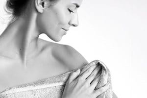 Woman wrapped in towel.